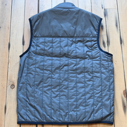 View of Filson Ultralight Vest in Storm Blue, showcasing its lightweight design and insulated features