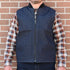 View of Filson Denim Insulated Work Vest in Raw Indigo featuring wool-blend rib-knit collar and four-pocket design