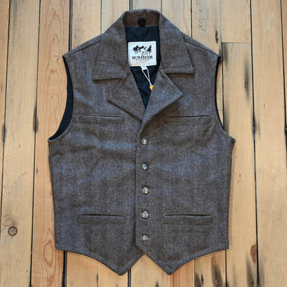 Taupe herringbone wool vest with lapel collar, running horse brass buttons, front and inside pockets, and hidden elastic back