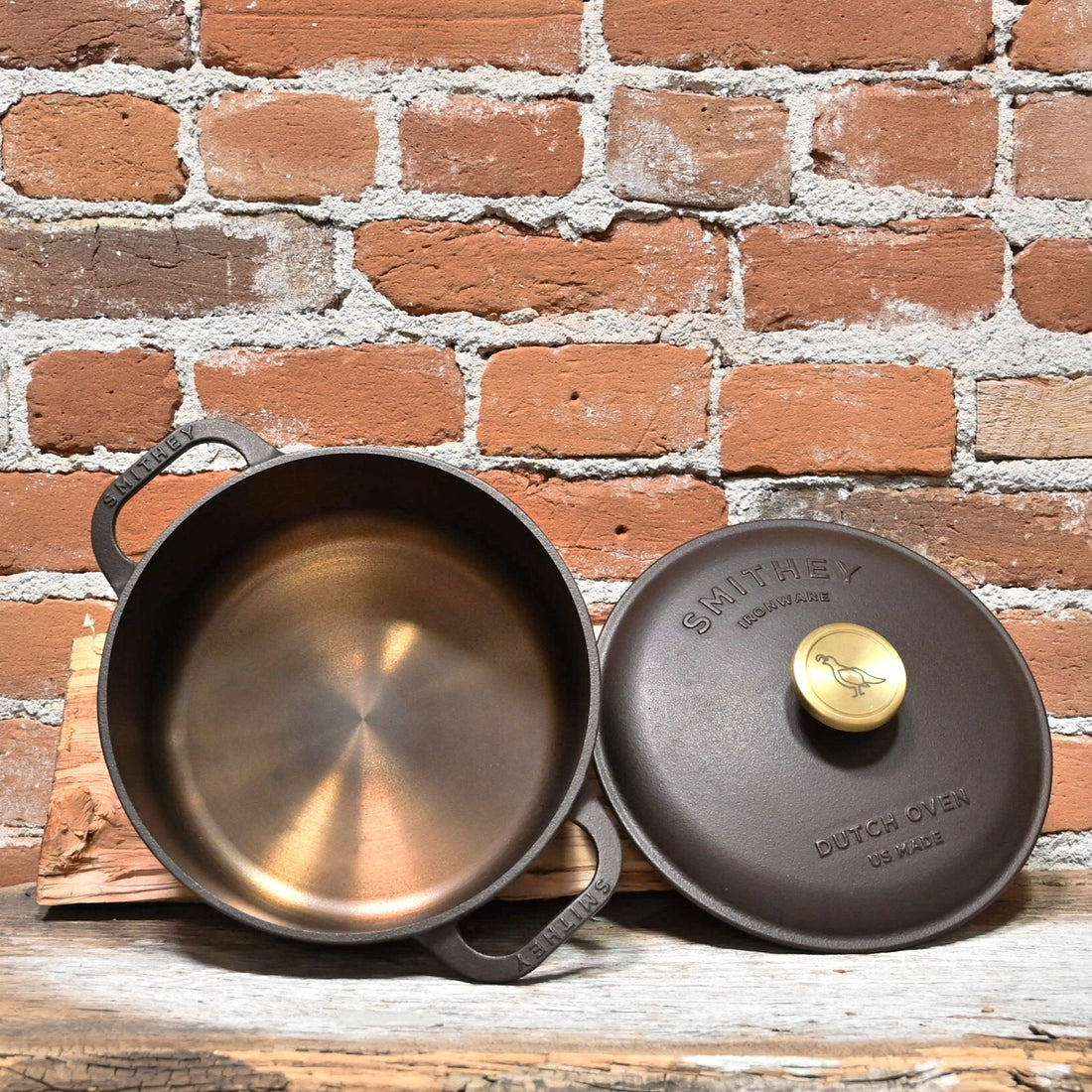 View of Smithey Ironware 5.5 qt Dutch Oven with polished interior and ergonomic handles