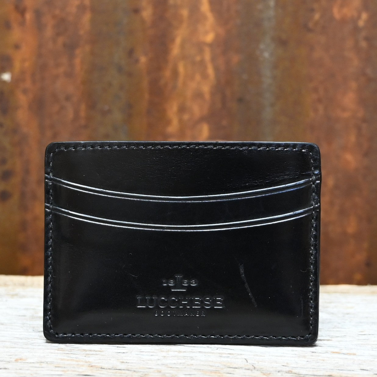 Lucchese black leather credit card case with contrast stitching in slim flat design
