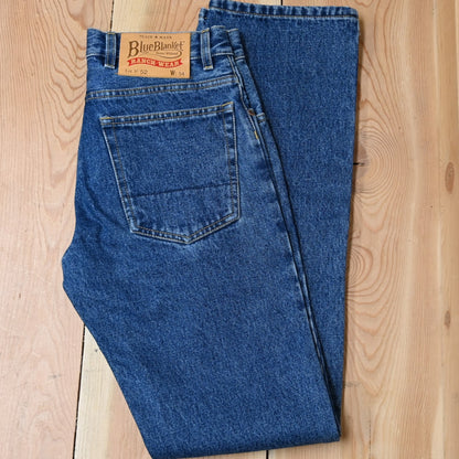 View of Blue Blanket men’s medium indigo straight-leg denim jeans with leather patch
