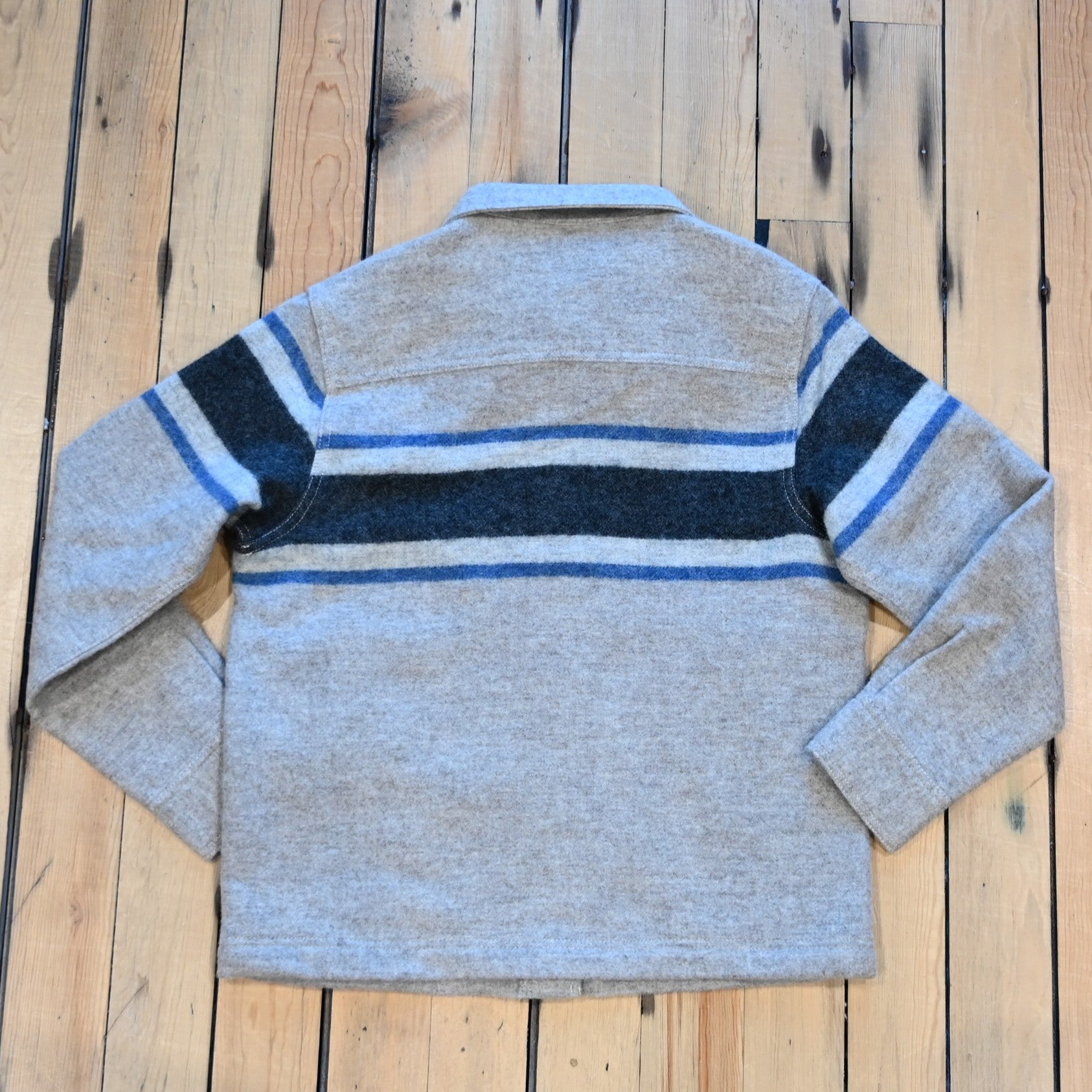 Filson Ladies Wool Overshirt in gray with black blanket stripes, chest pockets, and button front