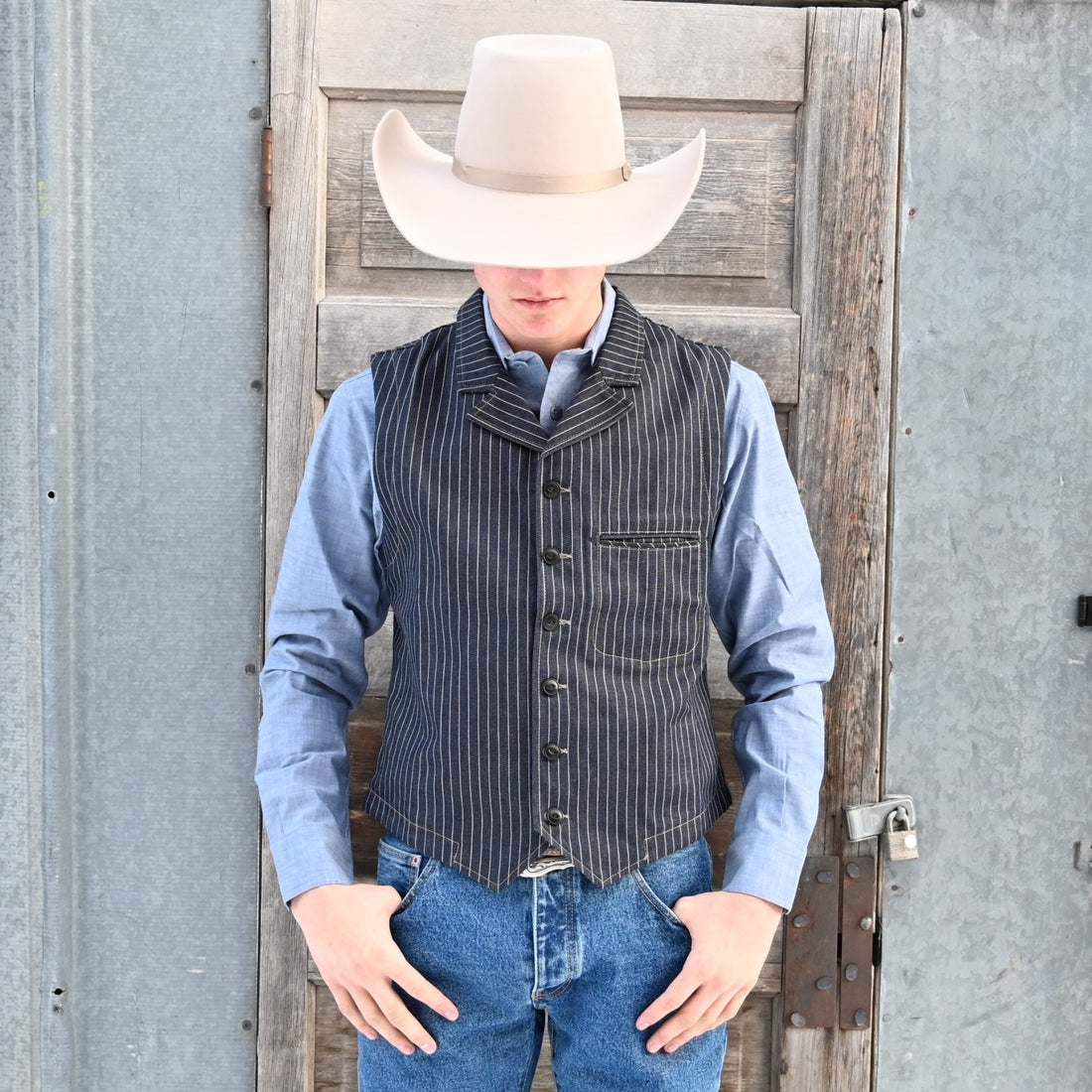 View of Blue Blanket men’s dark indigo denim vest with vertical stripes and button front