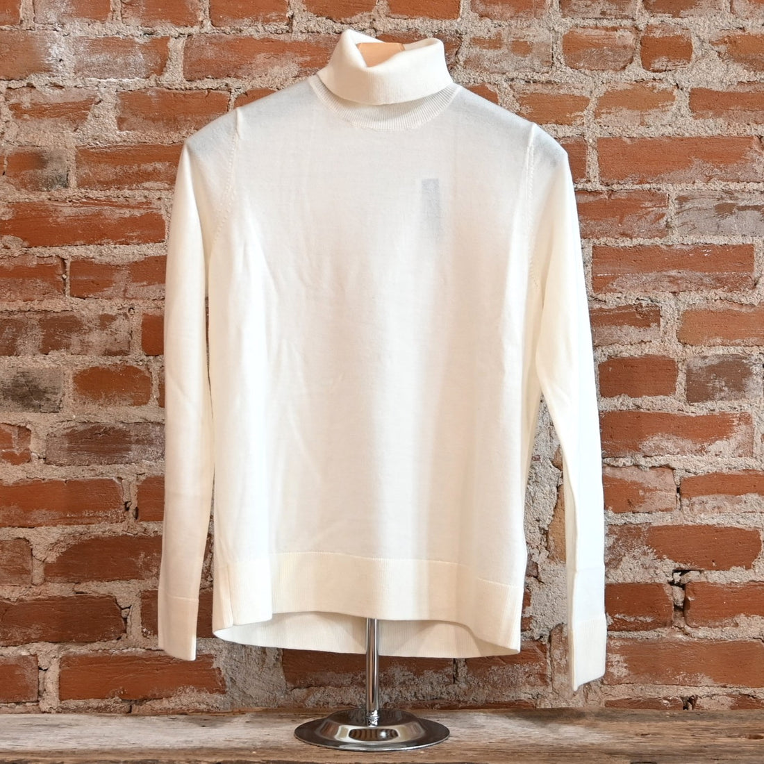 View of Pendleton ladies ivory merino turtleneck sweater with raglan sleeves and ribbed edges