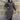View of Filson Ladies Duster Coat in Marsh Olive featuring cape over shoulders, four front cargo pockets, and corduroy-lined collar