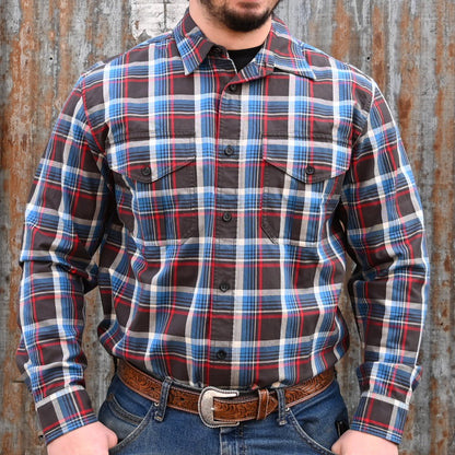 View of Filson Light Weight Alaskan Guide Shirt featuring button-front closure, chest pockets, and plaid pattern