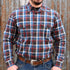 View of Filson Light Weight Alaskan Guide Shirt featuring button-front closure, chest pockets, and plaid pattern