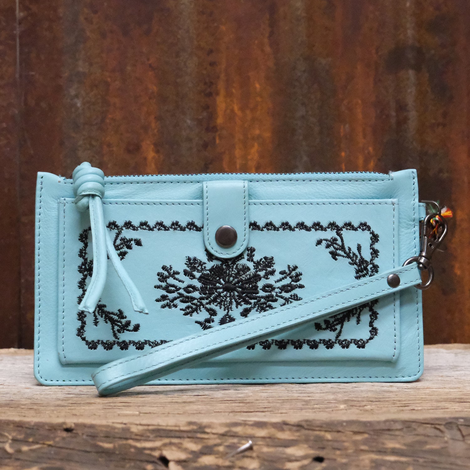 Myra Alpine blue leather wallet with textured Azure Mesa design and organized interior