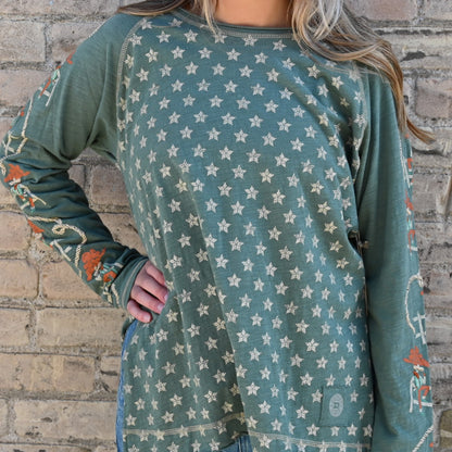 View of Double D Ranch Cowboys Up My Sleeve Top – Button-down top in Garcitas Green with cowboy-inspired print and a relaxed, flattering fit