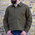 View of Filson Jungle Cloth Work Jacket featuring snap-secure front, adjustable cuffs, and multiple pockets