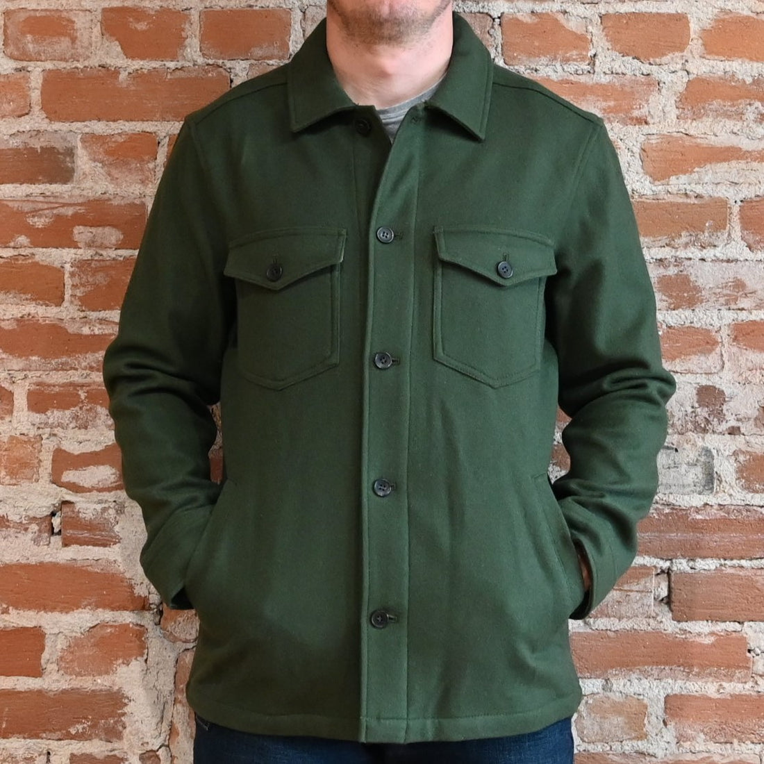 View of Pendleton men’s Lawson wool coat in solid army green with button front and five-pocket design