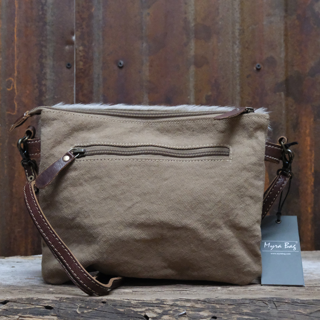 Myra Tropical printed canvas cross body bag with leather trim and zipper closure