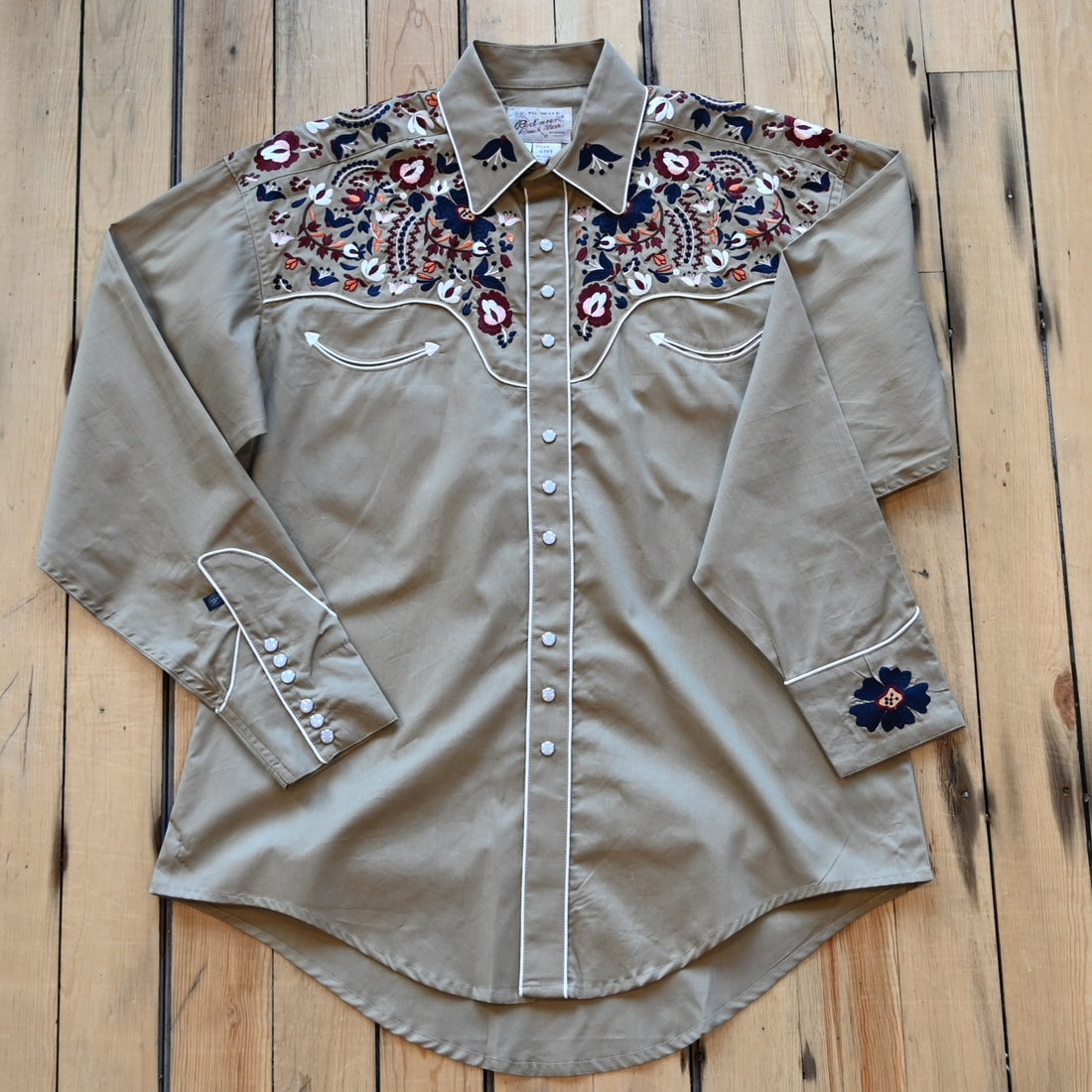 View of Rockmount men’s khaki Western shirt with floral embroidery and classic yoke styling