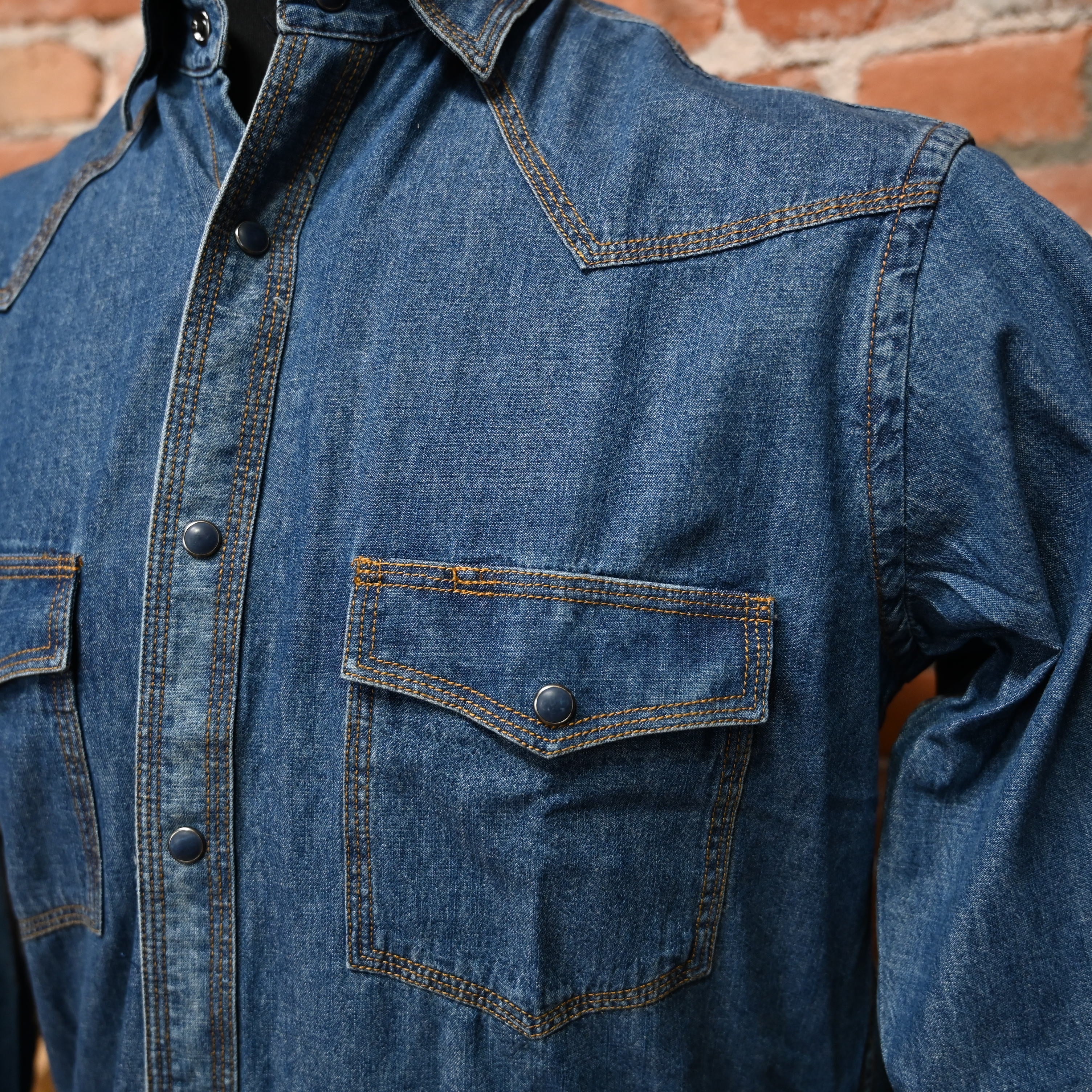 View of Indigo or blue Schaefer Classic Abilene western snap shirt with pumpkin stitching and pearl snaps