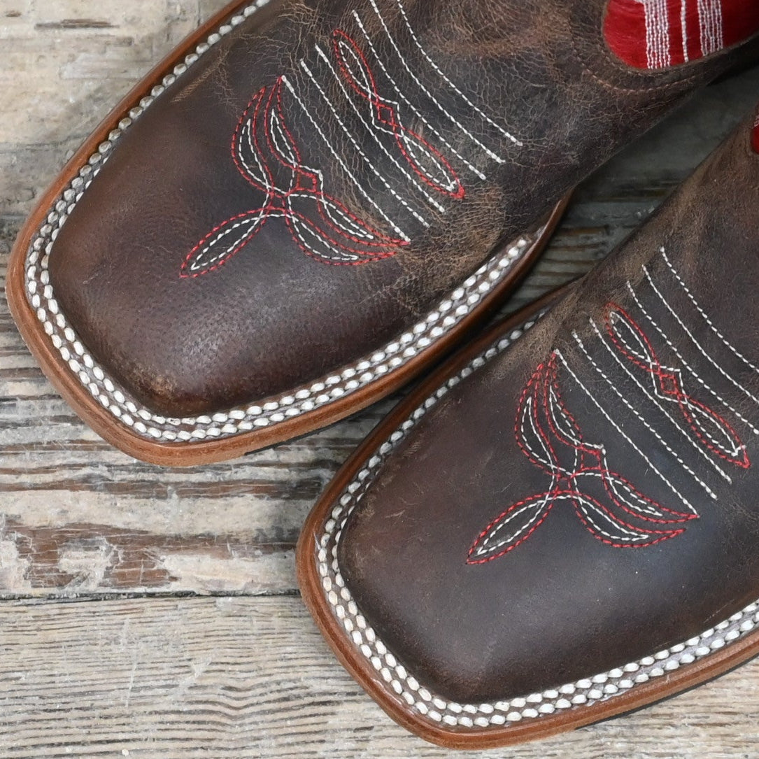 View of Anderson Bean kids boot with red top, saddle mad dog vamp, and pull straps