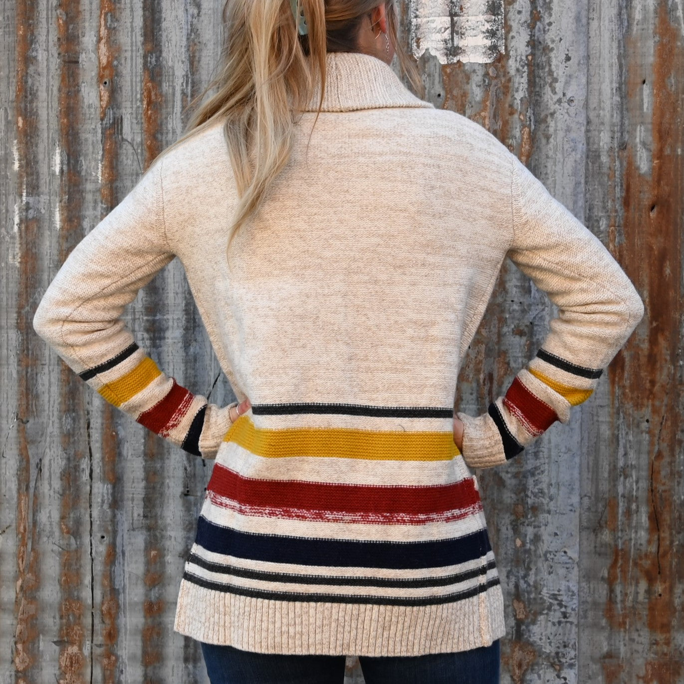 View of Pendleton lambswool cardigan with yellow, red, and black stripes and shawl collar