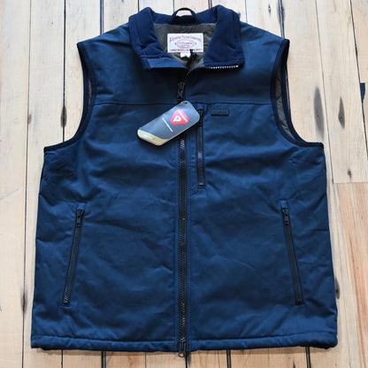 View of Filson Tin Cloth PrimaLoft® Vest in Black, Navy, and Dark Tan, showcasing durable waxed cotton exterior and fleece-lined interior