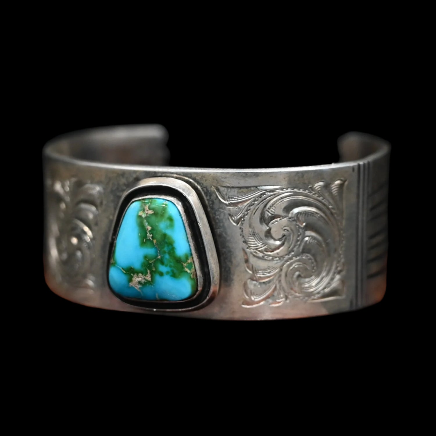 View of Sunwest Silver Leonard Nez Navajo Sonoran Gold Turquoise Cuff featuring Sonoran Gold turquoise with etched patterns in sterling silver
