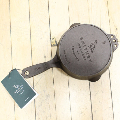 View of Smithey Ironware No. 6 Cast Iron Skillet with polished interior and ergonomic handle