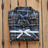 View of Pendleton men’s pajama set in navy and ochre plaid cotton flannel