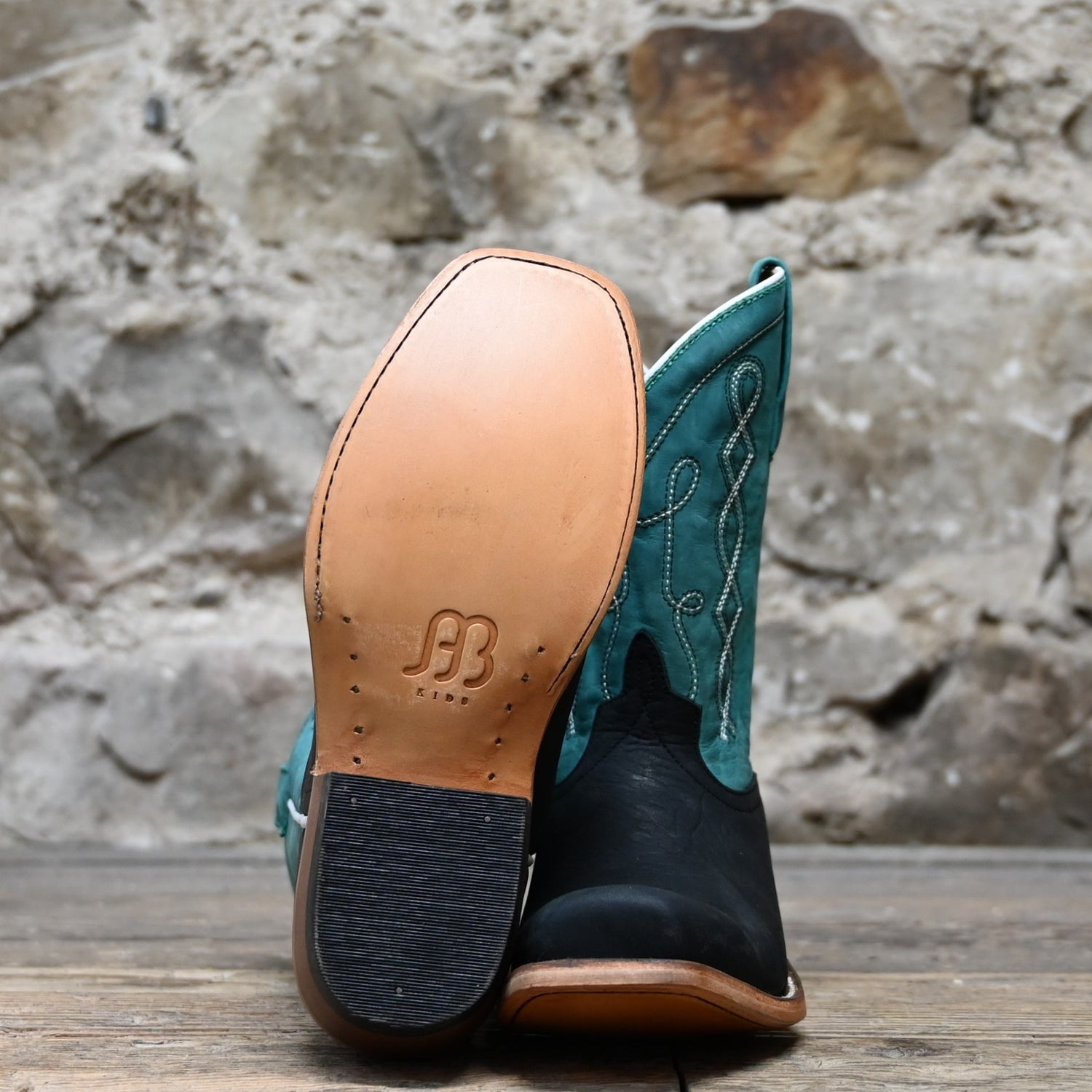 View of Anderson Bean Kids cowboy boot with black oiled shoulder vamp and sea foam leather top