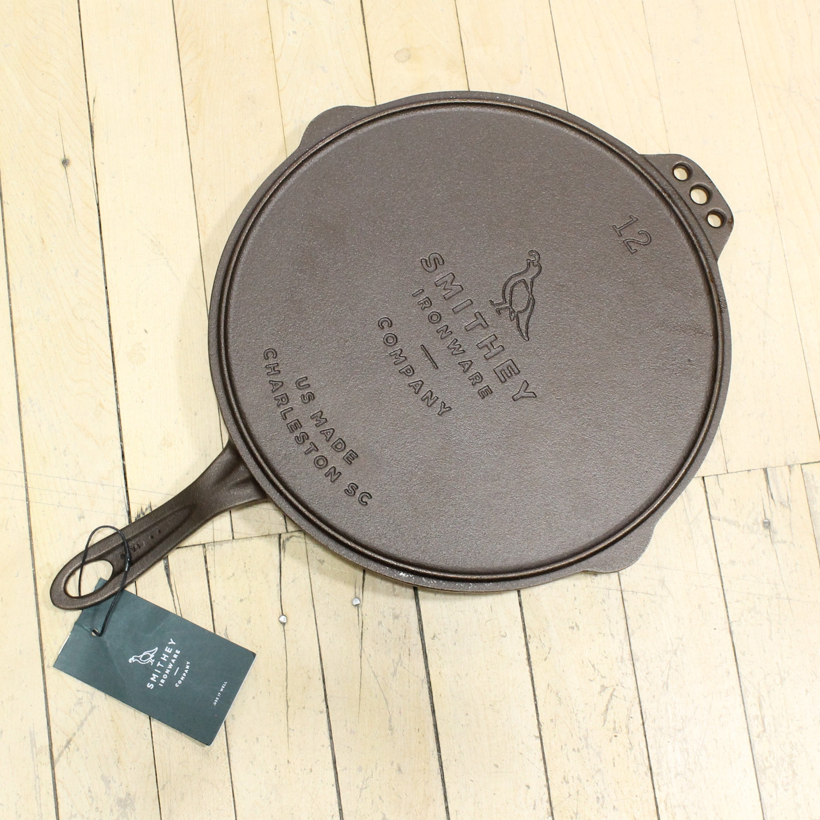 View of Smithey Ironware No. 12 Flat Top Griddle made from cast iron with a polished surface