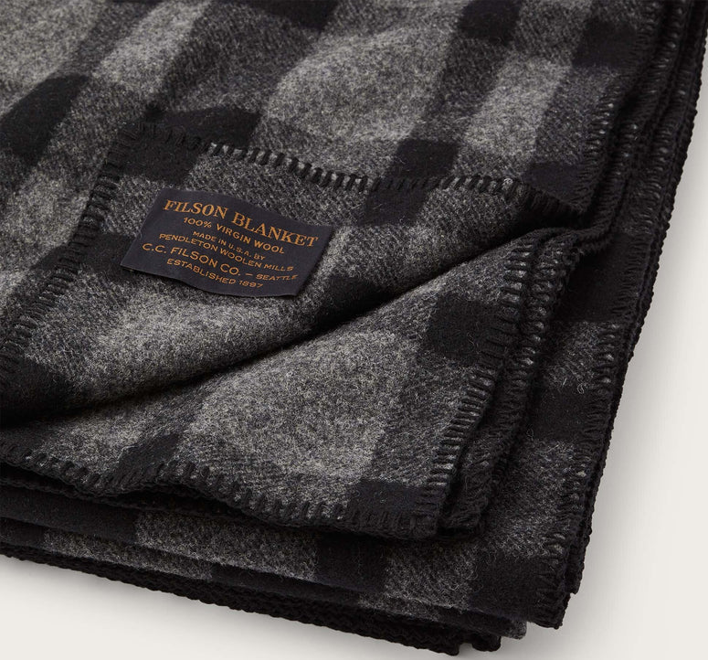 Filson Mackinaw wool blanket in black with serged edges and dense wool weave