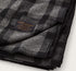 Filson Mackinaw wool blanket in black with serged edges and dense wool weave