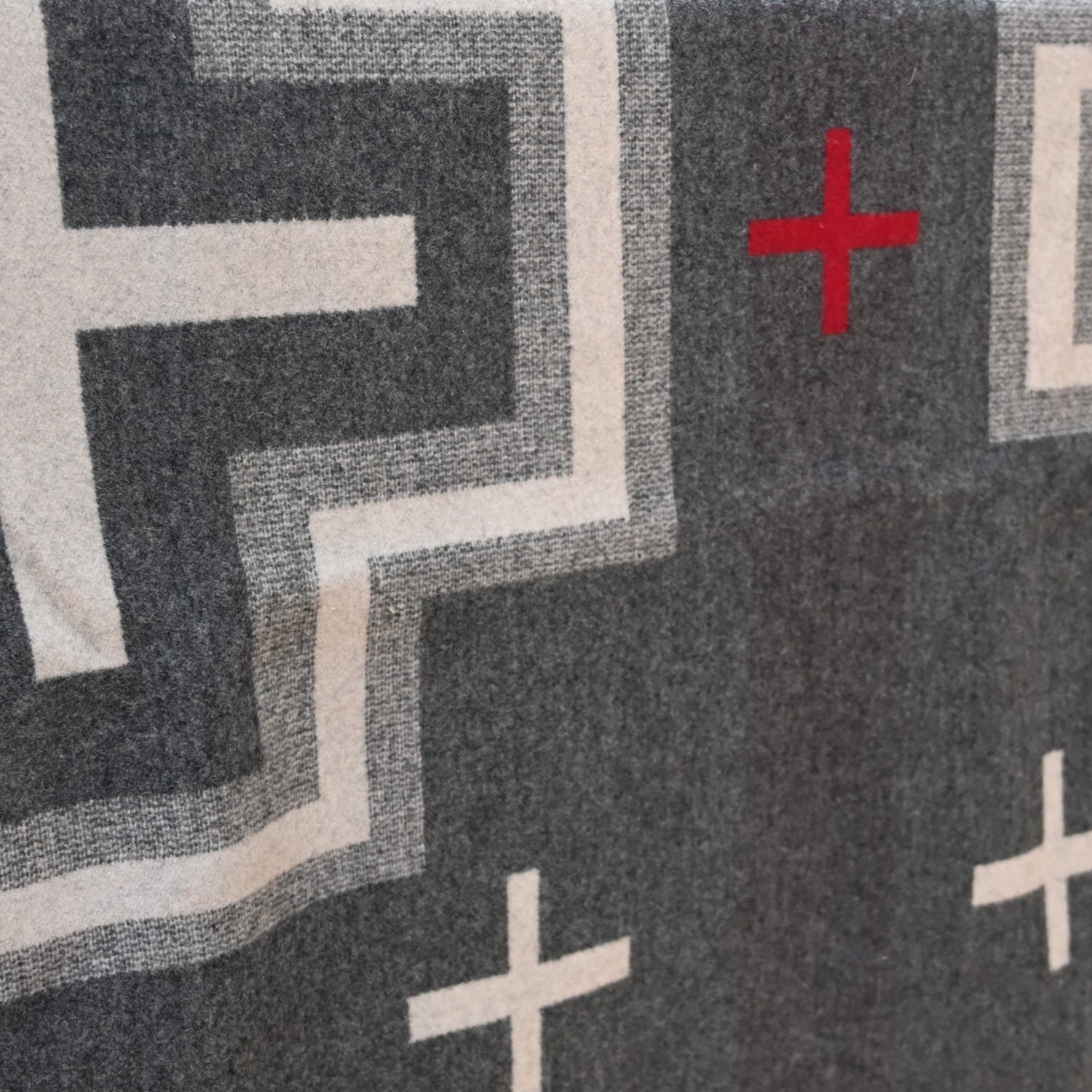 View of Pendleton San Miguel queen blanket with geometric jacquard pattern and Ultrasuede trim