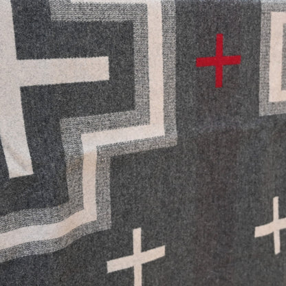 View of Pendleton San Miguel queen blanket with geometric jacquard pattern and Ultrasuede trim