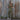 View of Filson Ladies Field Short Sleeve Coverall in Army Green featuring double-layer leg fronts, tool pockets, and hammer loop