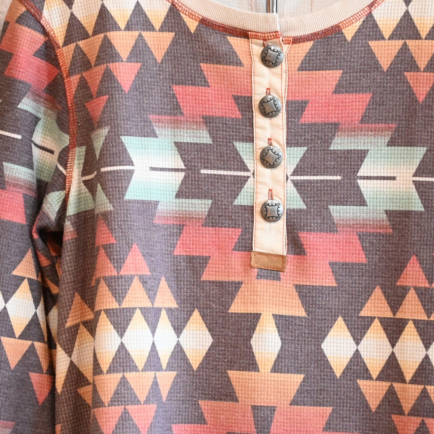 View of Double D Ranch Cowboy Bedroll Top featuring custom geometric print in autumn hues
