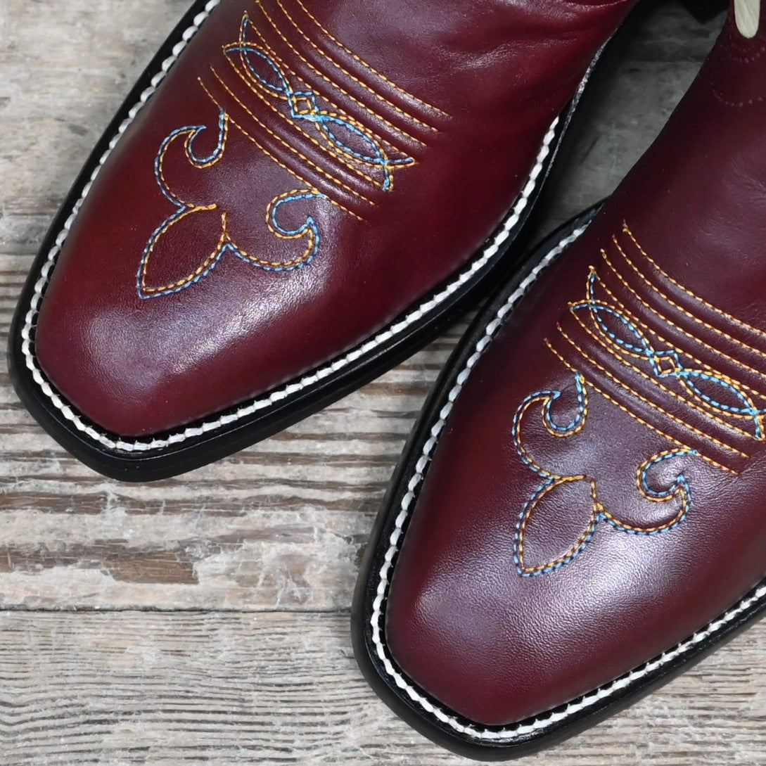 View of Atomic 79 exclusive Hondo Bronc Boot with bone top, burgundy vamp, French square toe, and spur lip