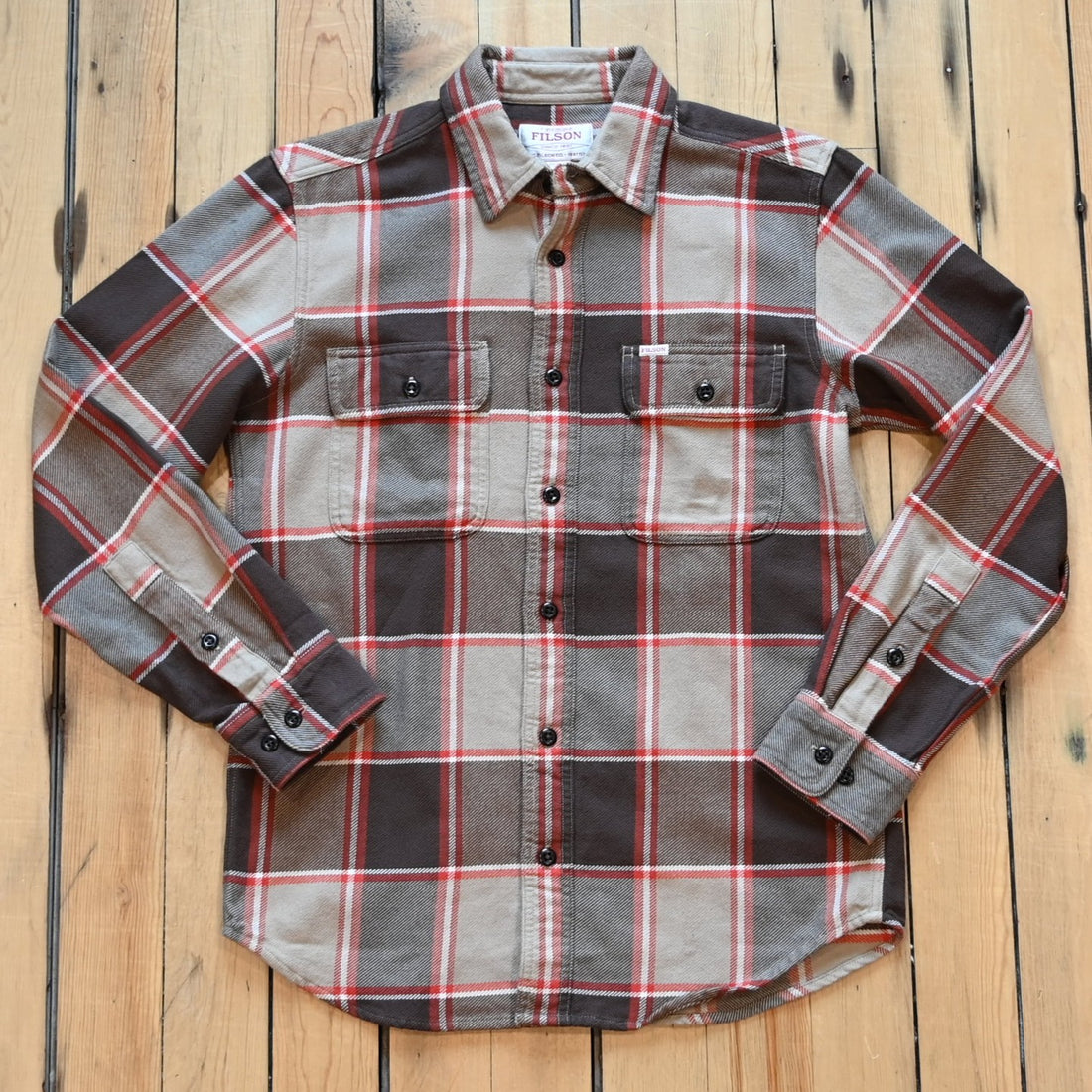 Filson Vintage Flannel Work Shirt in tan and orange multi-plaid with button-front pockets and brushed interior