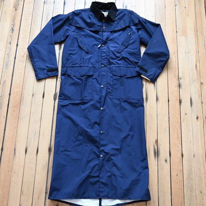 View of Navy waterproof Stockman duster by Schaefer with leather collar and storm flap