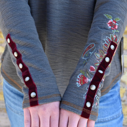 View of Double D Ranch Carpet Bagger Long Sleeve Tee – Patina-colored tee with a colorful yoke, pearl snap front, and intricate embroidery for a Western-inspired design