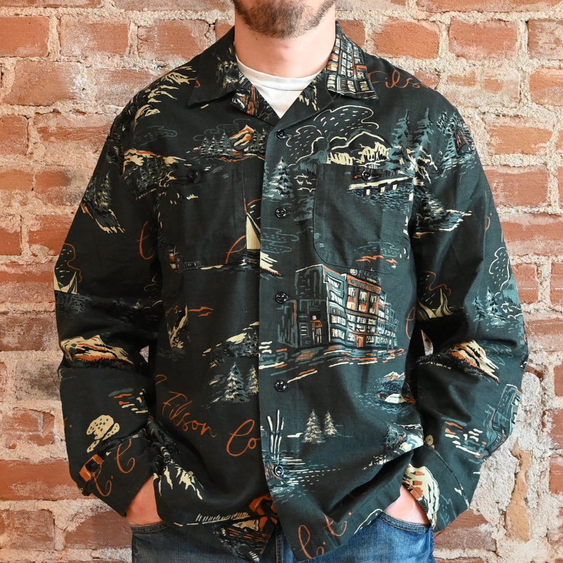 View of Filson Elk Heights Camp Shirt in Green NW Scenes and Blue/Black Khaki featuring unstructured camp collar and button-secured chest pockets
