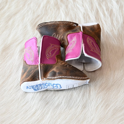 View of Anderson Bean Baby Bean boot with bone antique goat vamp, pink top, and soft sole