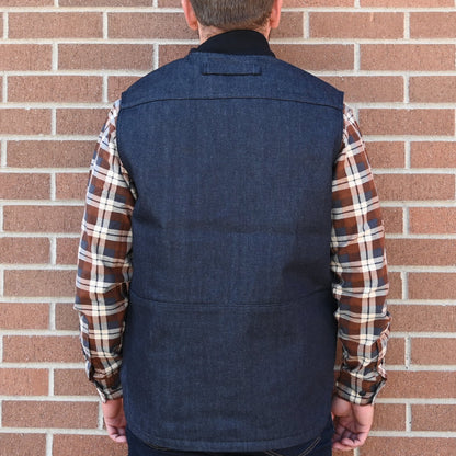 View of Filson Denim Insulated Work Vest in Raw Indigo featuring wool-blend rib-knit collar and four-pocket design