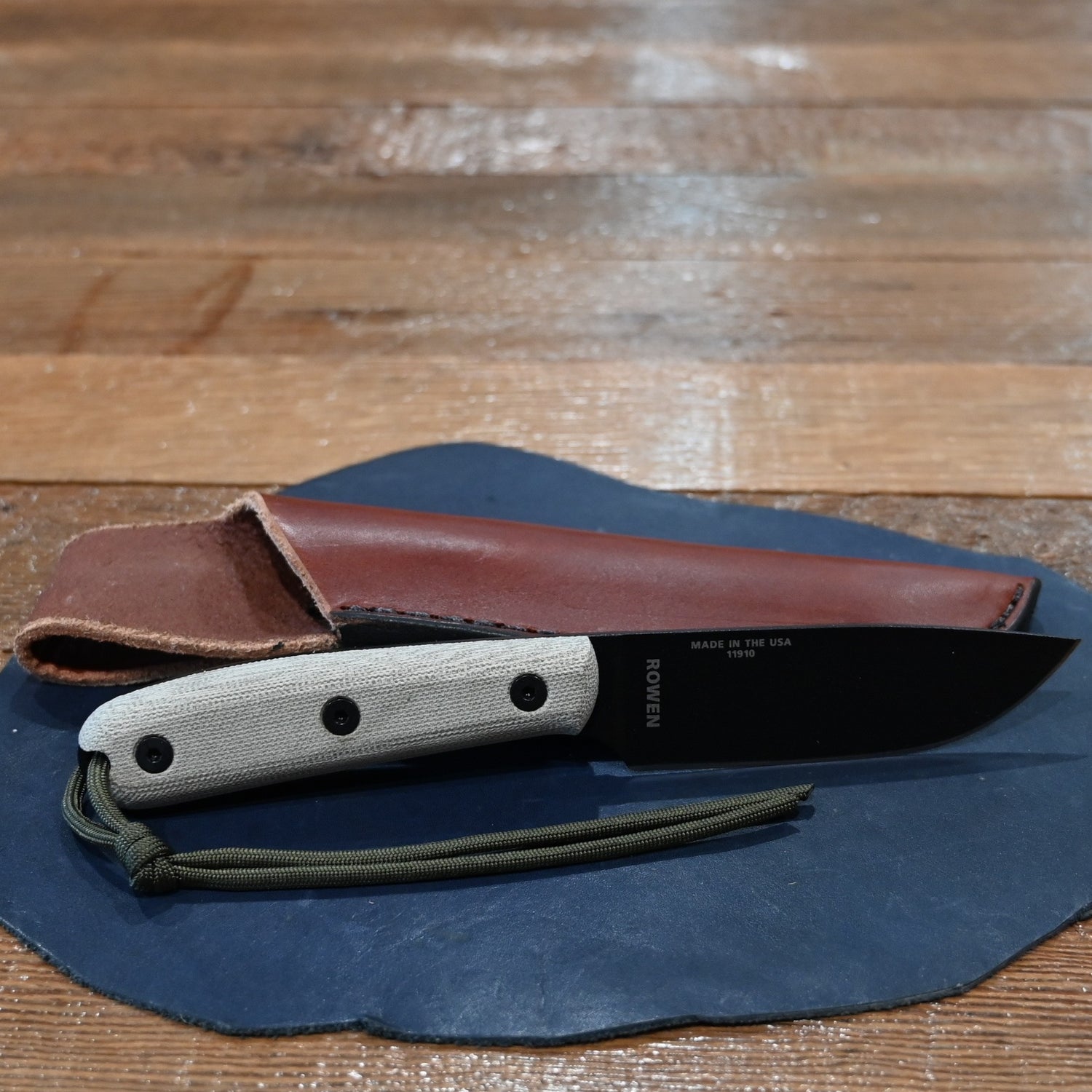 ESEE 4P knife with modified ergonomic handle and black leather sheath, 2025 edition