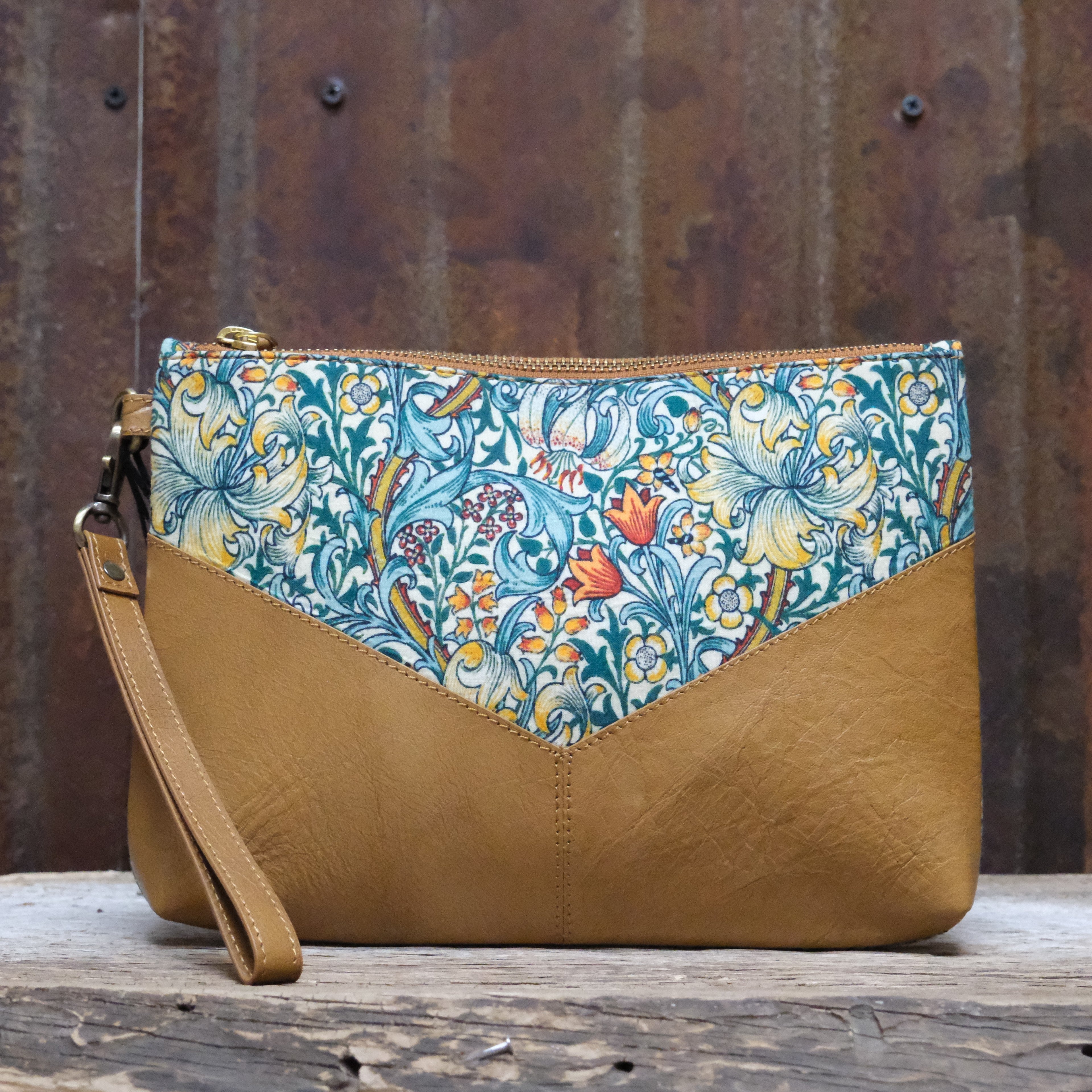 Myra My Own Garden printed canvas clutch bag with leather trim and zipper closure