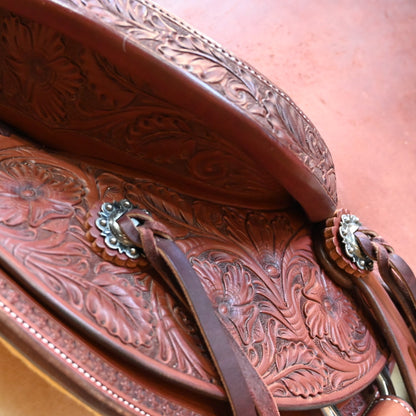 View of Deeter 3B Visalia Chestnut Saddle with floral border tooling