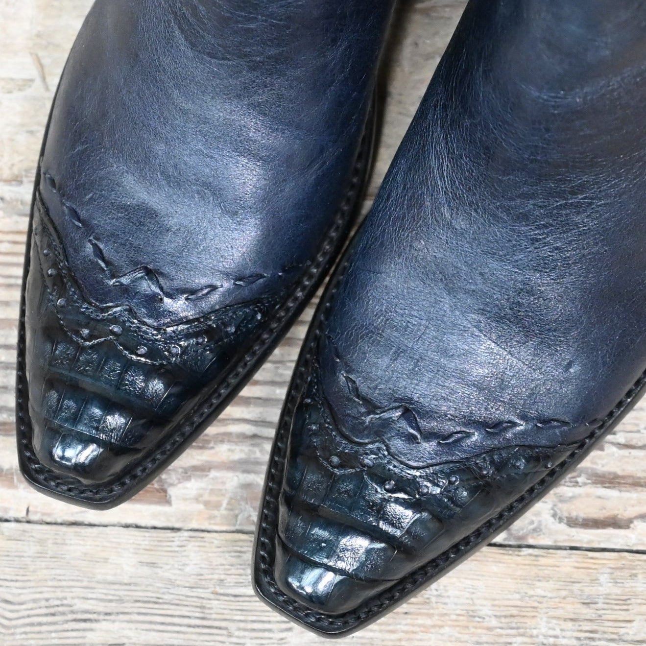 View of Stallion Ladies Zorro zip boot in dark navy Italian calf with caiman wingtip and pointed snip toe
