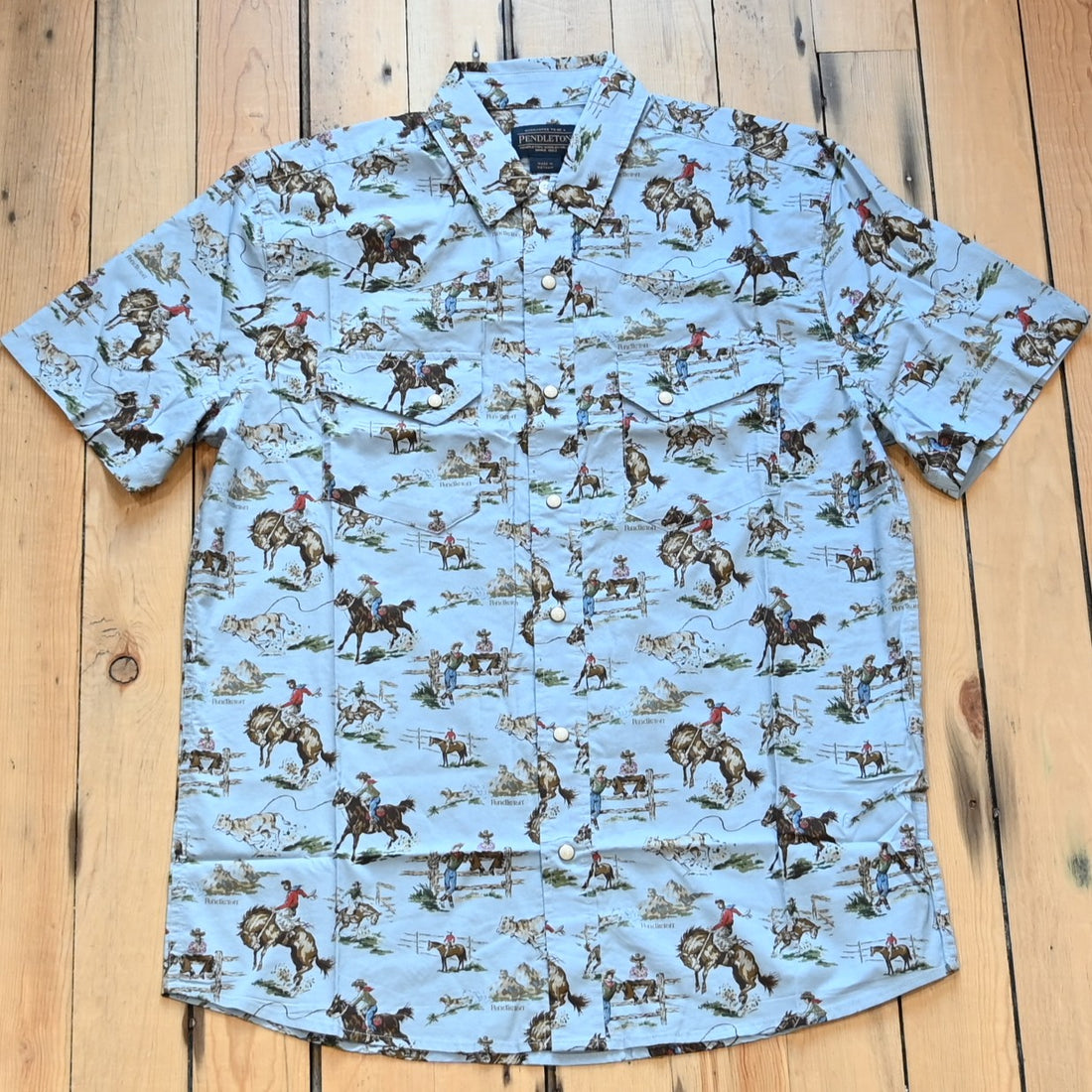Men’s short-sleeve Laramie shirt in Wild Horses pattern with snap front, peaked yokes, and classic fit