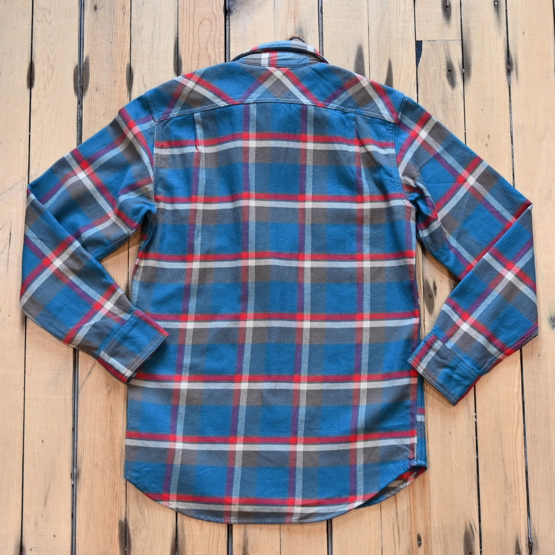 Filson Vintage Flannel Work Shirt in blue and gray multi plaid with chest pockets and button front