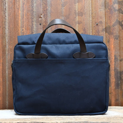 View of Filson Original Briefcase in Navy, showcasing rugged twill fabric and bridle leather accents
