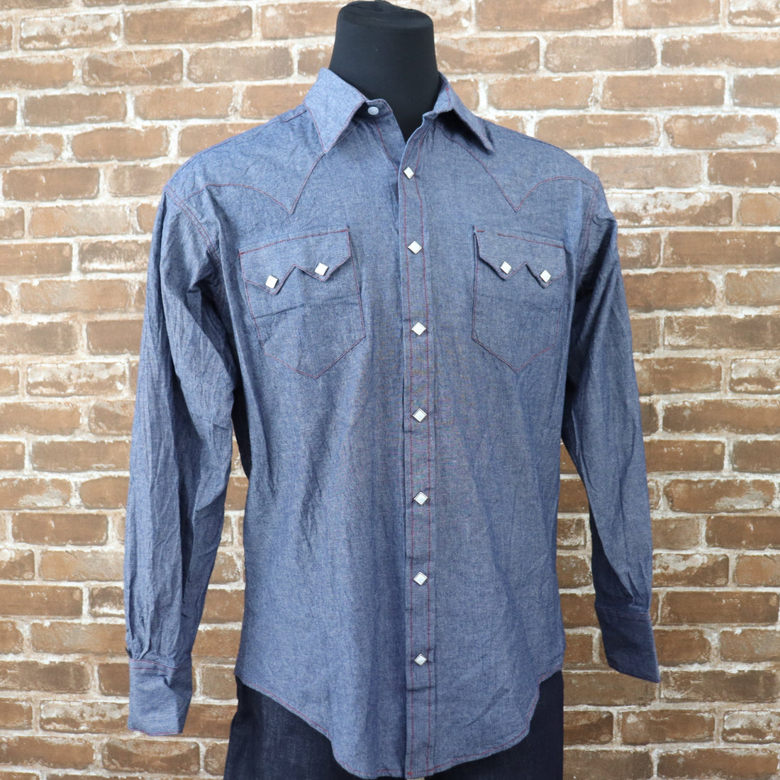 View of Rockmount blue chambray western shirt with sawtooth pockets and diamond snaps