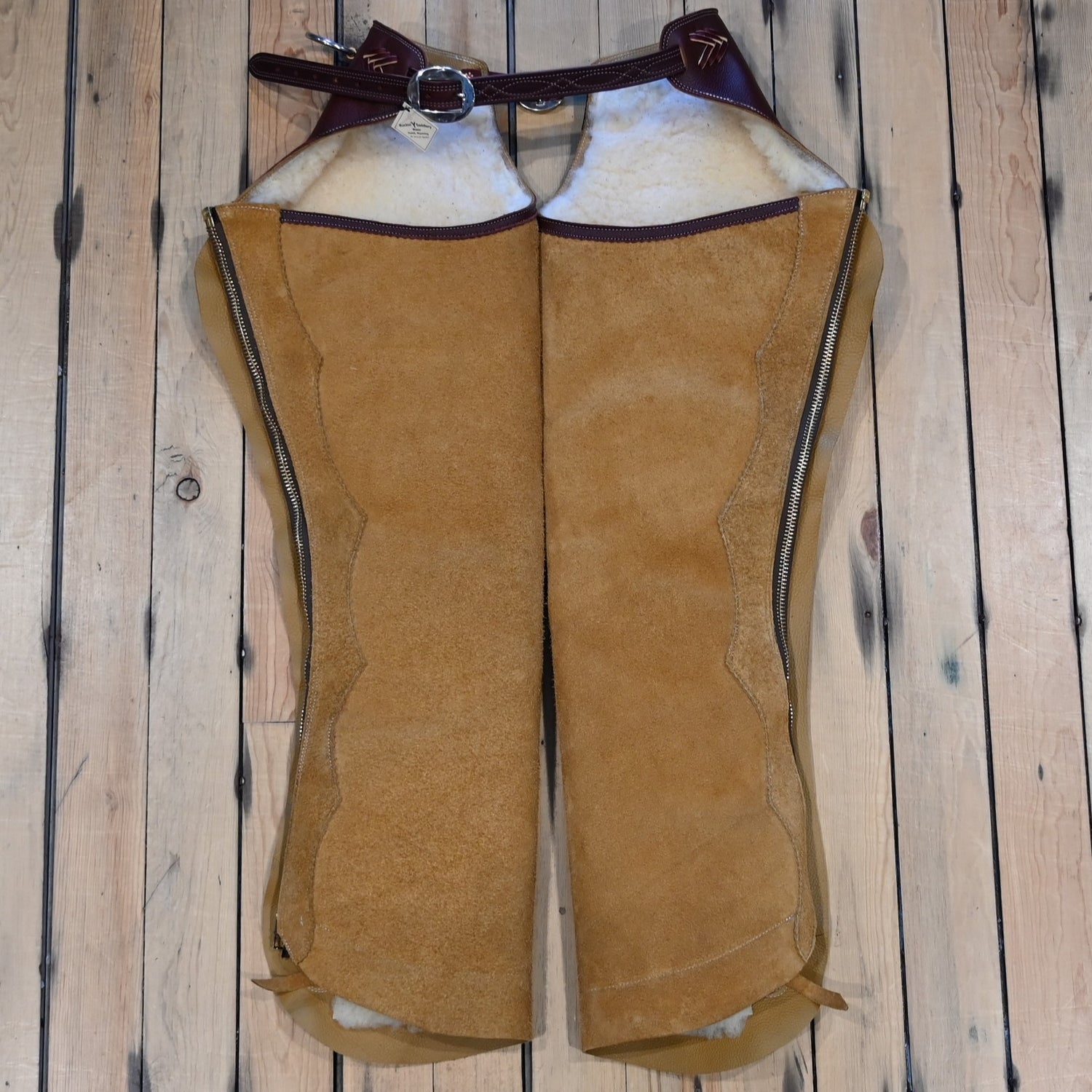 Rockin’ Y Saddlery rough-out leather Arizona work chaps with fleece lining, zipper closure, ring belt, and front pocket