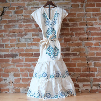 Sendero Provisions Co. The Emilia Dress in Ivory-Teal with floral embroidery.